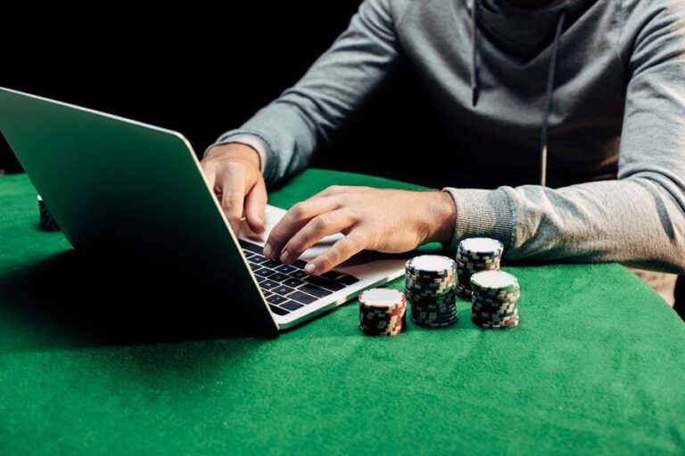 Player checking an online casino account on a laptop